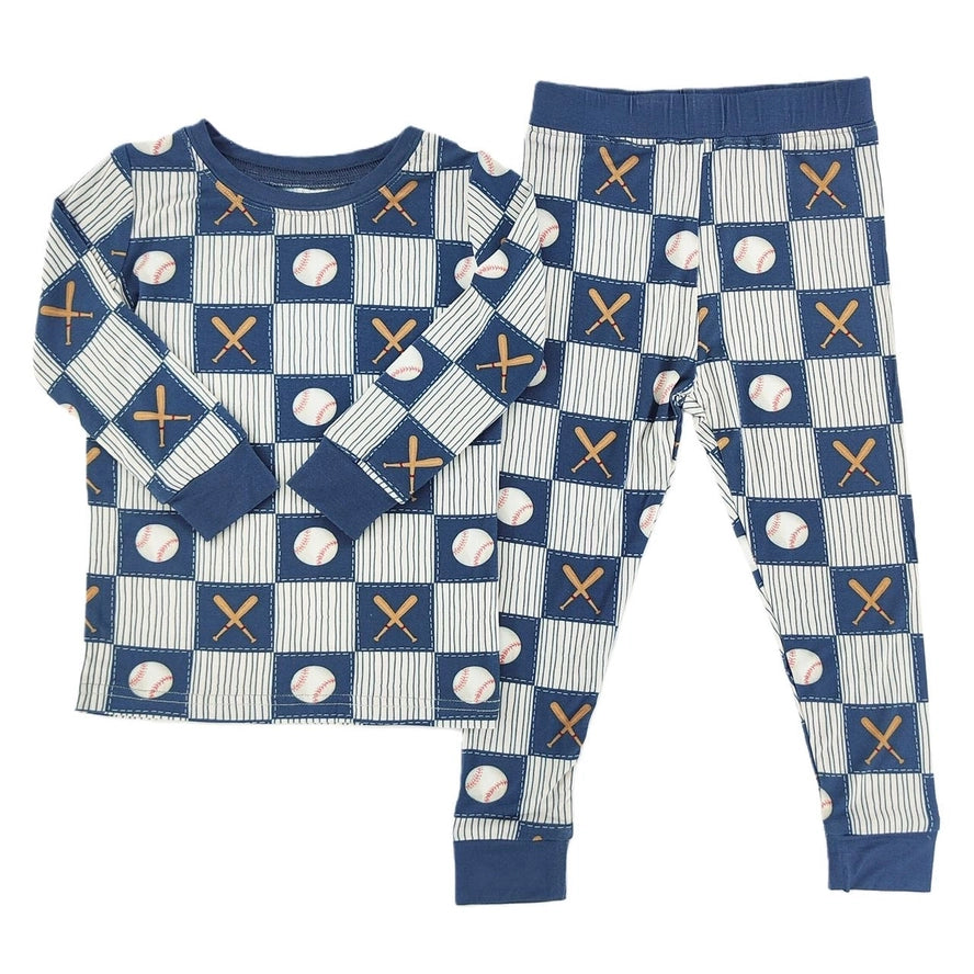 Children's pajama set with baseball and bat pattern on a white background