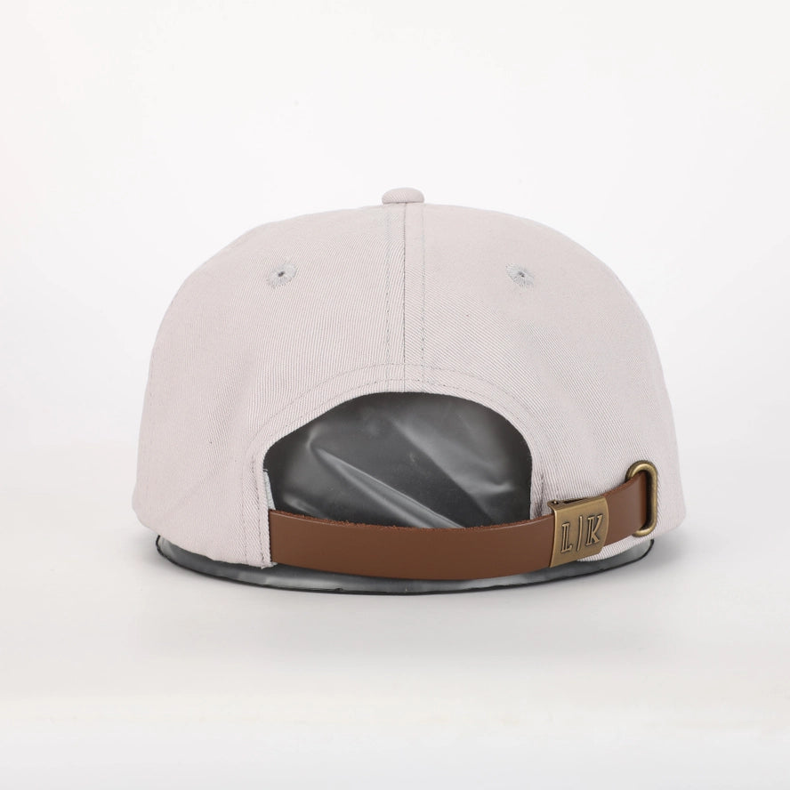 Cream little boys hat with adjustable strap