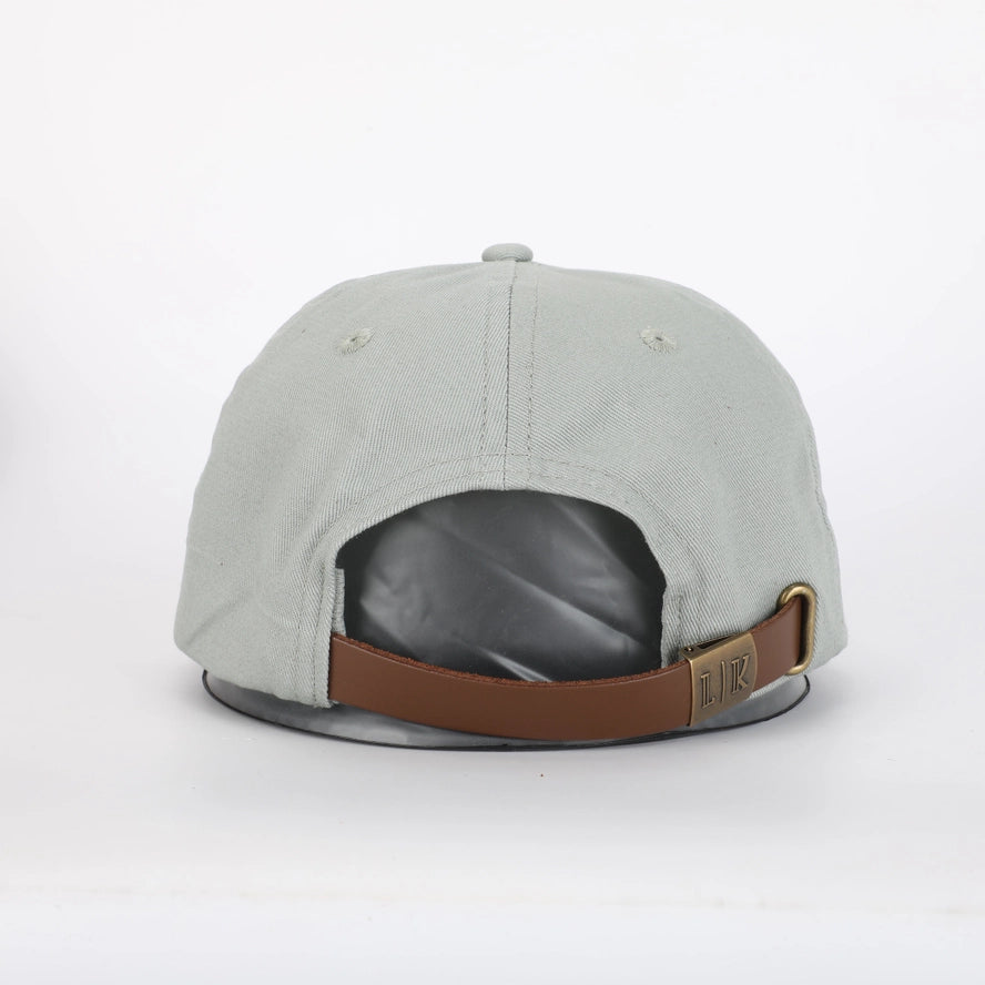 green boys hat with adjustable strap