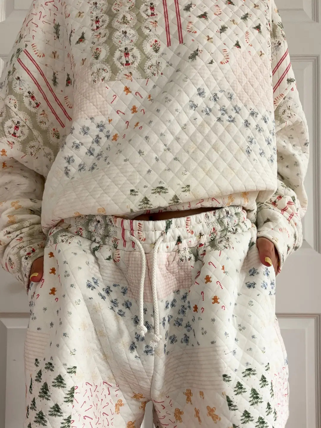 Floral patterned pajama set with a quilted top on a neutral background