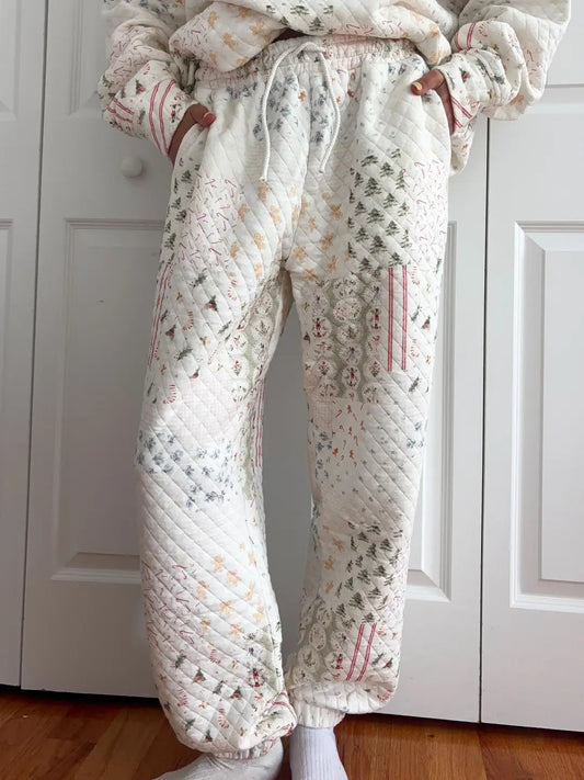 Floral patterned pajama set with matching pants and top on a plain background