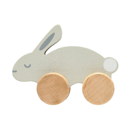 Wooden toy rabbit with wheels on a white background