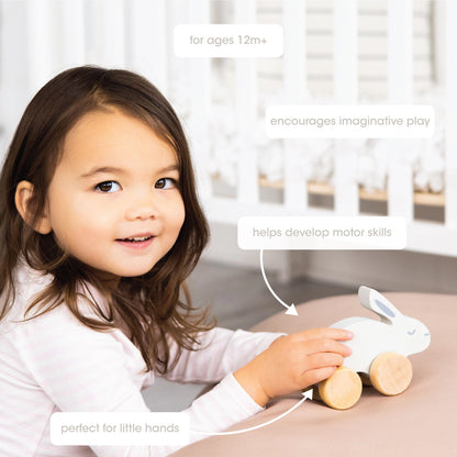 Child playing with a toy rabbit car, with text about its features.